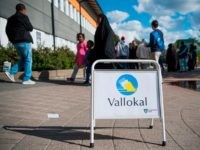 SWEDEN-POLITICS-VOTE People arrive to vote in the Swedish general elections at a polling station in the suburb of Rinkeby, north of Stockholm on September 9, 2018. (Photo by Jonathan NACKSTRAND / AFP) (Photo credit should read JONATHAN NACKSTRAND/AFP/Getty Images)