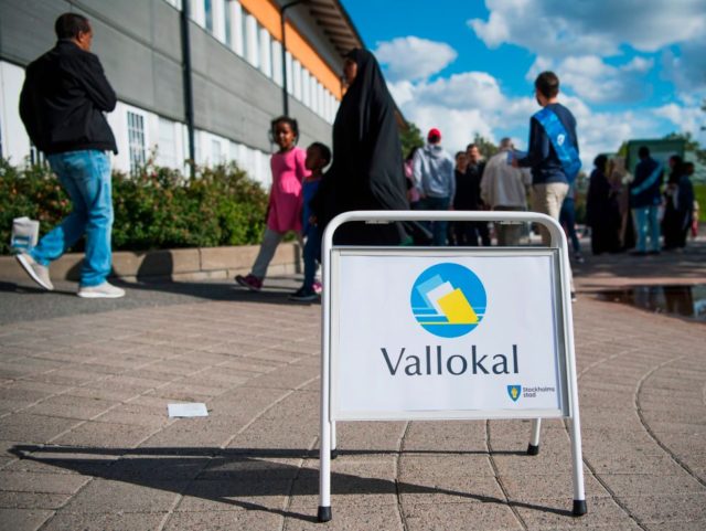 People arrive to vote in the Swedish general elections at a polling station in the suburb of Rinkeby, north of Stockholm on September 9, 2018. (Photo by Jonathan NACKSTRAND / AFP) (Photo credit should read JONATHAN NACKSTRAND/AFP/Getty Images)