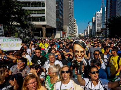 Supporters of Brazilian right-wing presidential candidate Jair Bolsonaro attend a rally at Paulista Avenue in Sao Paulo, Brazil on September 09, 2018. - Supporters of conservative presidential candidate Jair Bolsonaro demonstrated in support of the frontrunner on Sunday, who is convalescing after being stabbed while campaigning several days before. Bolsonaro …