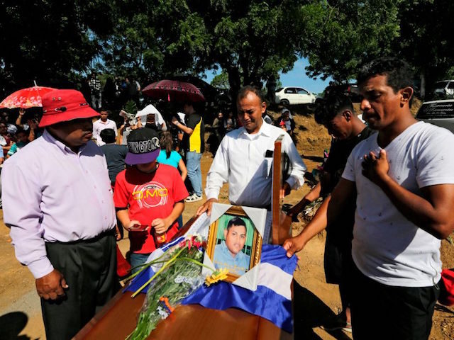 Relatives and friends mourn during the funeral of Ezequiel Leiva, 26, who died in the hosp