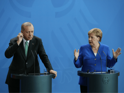 BERLIN, GERMANY - SEPTEMBER 28: Turkish President Recep Tayyip Erdogan and German Chancellor Angela Merkel speak to the media at the Chancellery on September 28, 2018 in Berlin, Germany. President Erdogan is on the second of a three-day visit to Germany that includes meetings with German President Frank-Walter Steinmeier and …