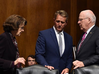 Senate Judiciary Committee members Dianne Feinstein (D-CA) (L), Jeff Flake (R-AZ) (C), and