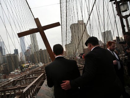 NEW YORK, NY - APRIL 03: Members of the Archdiocese of New York and the Diocese of Brooklyn lead the Way of the Cross procession over the Brooklyn Bridge on April 3, 2015 in New York City. The Way of the Cross is a traditional Catholic procession recalling the suffering …