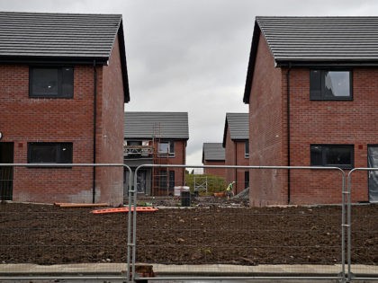 GLASGOW, SCOTLAND - OCTOBER 06: New housing under construction in the Govan area on October 6, 2015 in Glasgow, Scotland. Recent reports indicate that affordable housing in Scotland needs to be double what is currently being built at the moment. At least 12,000 homes need to be built every year …