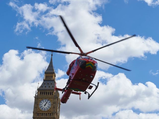 A London air ambulance takes off from Parliament Square in front of the Houses of Parliame