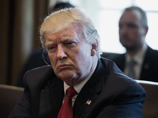 US President Donald Trump listens to a speaker during a meeting about opioid and drug abus