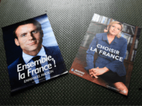 GettyImages-673302076 Electoral posters of French presidential election candidate for the En Marche ! movement Emmanuel Macron (L) and French presidential election candidate for the far-right Front National (FN) party Marine Le Pen (R) are displayed in a warehouse in Gonesse, north of Paris on April 26, 2017, ahead of the second …