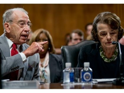 Senate Judiciary Committee Chairman Chuck Grassley, R-Iowa, left, accompanied by Sen. Dian