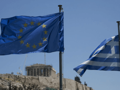 A Greek national flag and a European Union flag flutter in the wind as the Parthenon is seen on the Acropolis archaeological site in Athens, Greece. The Greek government borrowed billions from the EU as part of three large bailout programs that Athens has now completed. File Photo by Dimitris …