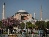 Hagia Sophia People Walk in front of the Hagia Sofia in Sultanahmet on April 24, 2018 in Istanbul, Turkey. As peak tourism season approaches early booking figures and foreign demand suggest Turkey will reach a record of 40 million visitors in 2018. The tourism sector suffered big losses in 2016 due to …