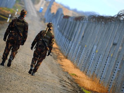 Border soldiers patrol along the border fence at the Hungarian-Serbian border near Hercegszanto border station on December 14, 2017. Since July 2015 Hungary secured the more than 300-km-long border to Serbia with the construction of a fence and 24 hours a day security patrol tasks. Several thousand soldiers participate in …