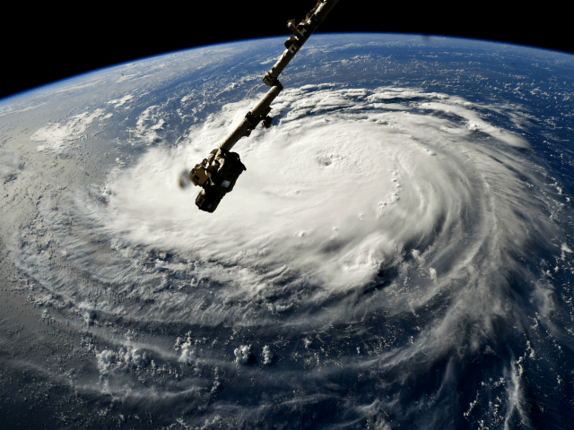 In this NASA handout image taken by Astronaut Ricky Arnold, Hurricane Florence gains stren