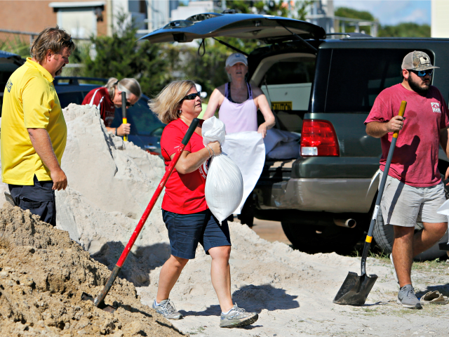 Residents of the Isle of Palms, S.C., fill sand bags at the Isle of Palms municipal lot wh