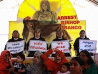 Indian Christian nuns and Muslim supporters protest as they demand the arrest of Bishop Franco Mulakkal, who is accused of raping a nun, outside the High Court in Kochi in the southern Indian state of Kerala on September 13, 2018 - Indian police on September 12 summoned for questioning a …