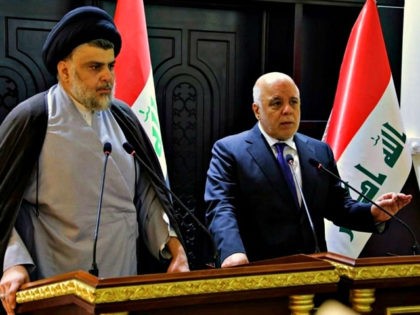 In this photo provided by the Iraqi government, Iraqi Prime Minister Haider al-Abadi, right, and Shiite cleric Muqtada al-Sadr hold a press conference in the heavily fortified Green Zone in Baghdad, Iraq, early Sunday, May 20, 2018. Shiite cleric Muqtada al-Sadr, whose coalition won the largest number of seats in …