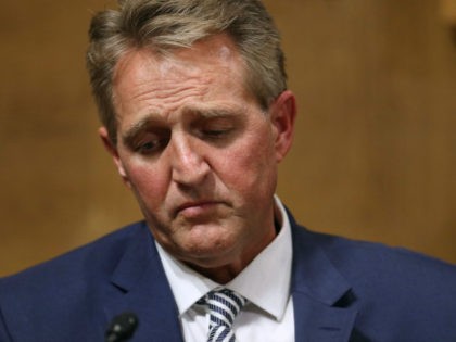 Senate Judiciary Committee Sen. Jeff Flake (R-AZ) listens to fellow committee members debate the confirmation of Supreme Court nominee Judge Brett Kavanaugh during a mark up hearing in the Dirksen Senate Office Building on Capitol Hill September 28, 2018 in Washington, DC. Flake was crucial in getting the committee to …