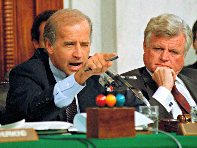 In this Oct. 12, 1991, file photo, then-Senate Judiciary Committee Chairman Sen. Joe Biden, D-Del., points angrily at Clarence Thomas during comments at the end of hearings on Thomas' nomination to the Supreme Court on Capitol Hill. Sen. Edward Kennedy, D-Mass., watches at right.