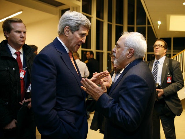 In this Jan. 16, 2016 file-pool photo, Secretary of State John Kerry talks with Iranian Foreign Minister Mohammad Javad Zarif in Vienna, after the International Atomic Energy Agency (IAEA) verified that Iran has met all conditions under the nuclear deal. Donald Trump isn’t going to rip up the Iran nuclear …