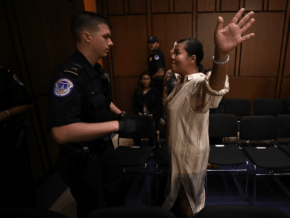 Protesters disrupt the start of the Supreme Court nominee Judge Brett Kavanaugh's confirmation hearing before the Senate Judiciary Committee in the Hart Senate Office Building on Capitol Hill September 4, 2018 in Washington, DC. Kavanaugh was nominated by President Donald Trump to fill the vacancy on the court left by …