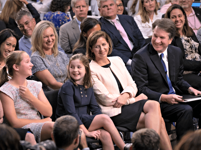 Supreme Court nominee, Brett Kavanaugh, far right, smiles as he sits with his family, from