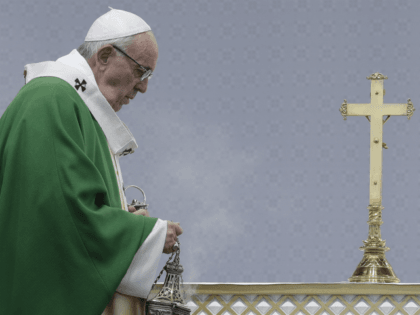 Pope Francis spreads incence on the alter during an open-air Mass at Santakos Park, in Kau