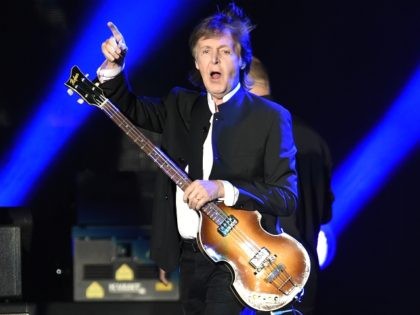 Paul McCartney greets the crowd as he arrives onstage for his performance on day 2 of the 2016 Desert Trip music festival at Empire Polo Field on Saturday, Oct. 8, 2016, in Indio, Calif. (Photo by Chris Pizzello/Invision/AP)