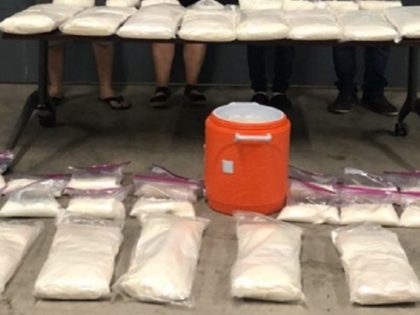 Mexican police seize 160 kilos of methamphetamine in a Tijuana drug lab raid. (Photo: Elem