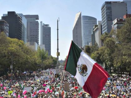 Demonstrators opposed to the policies of President Trump and Mexican President Enrique Peña Nieto march to the Plaza Angel Independencia in Mexico City on Feb. 12.