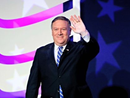 Secretary of State Mike Pompeo waves after speaking to the 2018 Values Voter Summit in Washington, Friday, Sept. 21, 2018.