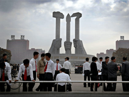In this Oct. 8, 2015 file photo, North Koreans gather at a monument built 10 years ago to