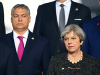 Orban May (L-R) US President Donald Trump, Hungarian Prime Minister Viktor Orban and British Prime Minister Theresa May, pose for a family picture during the NATO (North Atlantic Treaty Organization) summit at the NATO headquarters, in Brussels, on May 25, 2017. / AFP PHOTO / POOL / Stefan Rousseau (Photo credit should …