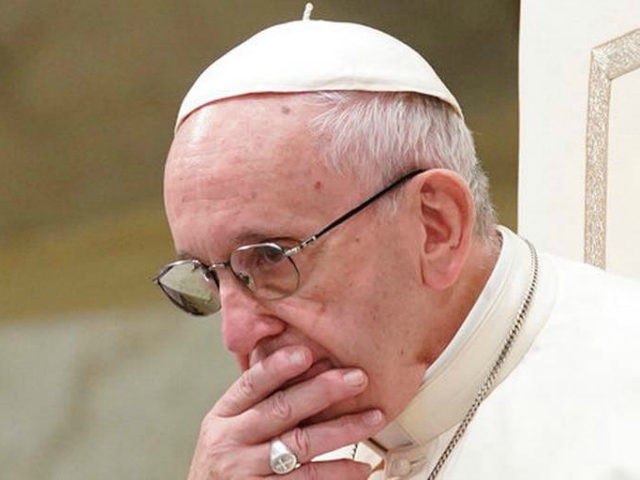 In this Aug. 22, 2018 file photo, Pope Francis is caught in pensive mood during his weekly general audience at the Vatican. Francis' papacy has been thrown into crisis by accusations that he covered-up sexual misconduct by ex-Cardinal Theodore McCarrick. (AP Photo/Andrew Medichini, File)