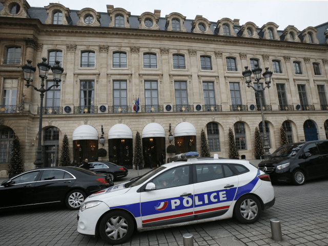 A police car drives past the Ritz hotel in Paris, Thursday, Jan. 11, 2018. Paris police ha
