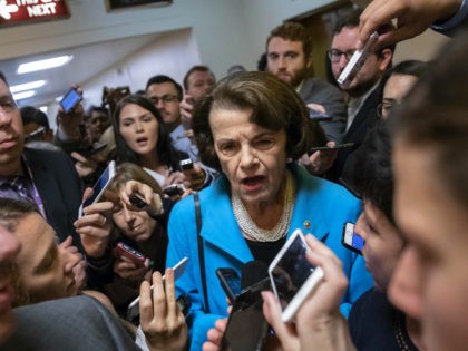 FILE - In this Tuesday, Sept. 18, 2018, file photo, Sen. Dianne Feinstein, D-Calif., the ranking member on the Senate Judiciary Committee, responds to reporters' questions on Supreme Court nominee Brett Kavanaugh amid scrutiny of a woman's claim he sexually assaulted her at a party when they were in high …