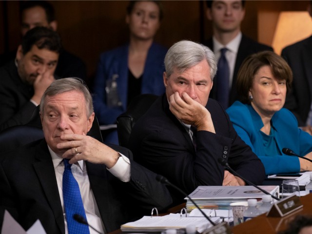 Democrats on the Senate Judiciary Committee, from left, Sen. Dick Durbin, D-Ill., Sen. Sheldon Whitehouse, D-R.I., and Sen. Amy Klobuchar, D-Minn., and other minority members, appeal to Chairman Chuck Grassley, R-Iowa, to delay the confirmation hearing of President Donald Trump's Supreme Court nominee, Brett Kavanaugh, on Capitol Hill in Washington, Tuesday, Sept. 4, 2018. (AP Photo/J. Scott Applewhite)