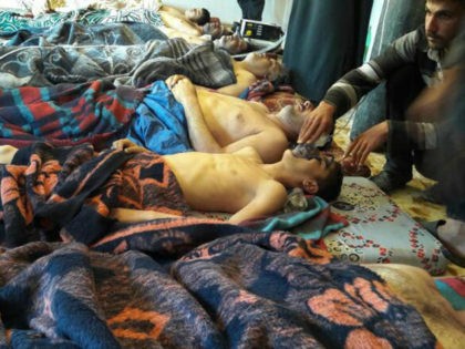 FILE - In this April 4, 2017 file photo, victims of a suspected chemical weapons attack li