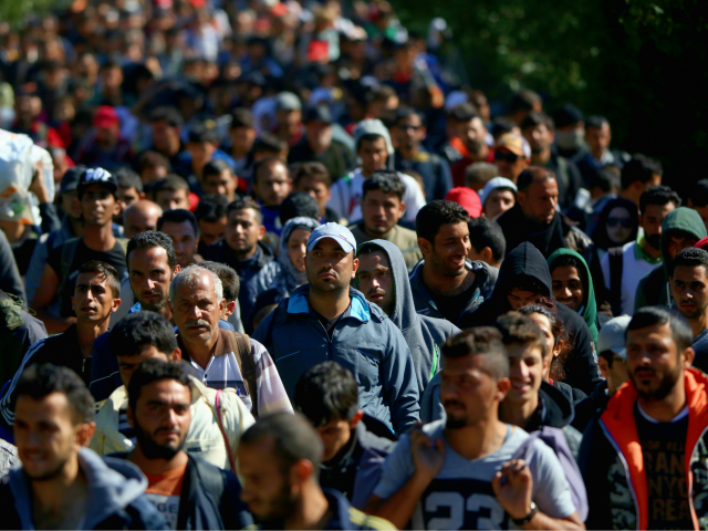 HEGYESHALOM, HUNGARY - SEPTEMBER 22: Hundreds of migrants who arrived on the second train