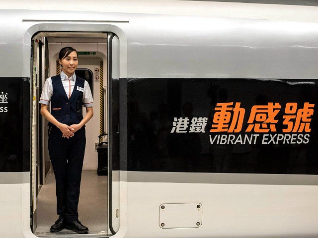 Hong Kong Fanny Chan, the train purser of the 'Vibrant Express', poses for a photo at the