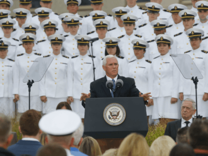 Vice President Mike Pence, center, speaks during the September 11th Pentagon Memorial Observance at the Pentagon on the 17th anniversary of the September 11th attacks, Tuesday, Sept. 11, 2018. Also on stage is Defense Secretary Jame Mattis, right. (AP Photo/Pablo Martinez Monsivais)