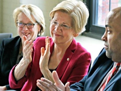 Warren Fundraising In this March 3, 2017, photo, Sen. Elizabeth Warren, D-Mass., middle, a