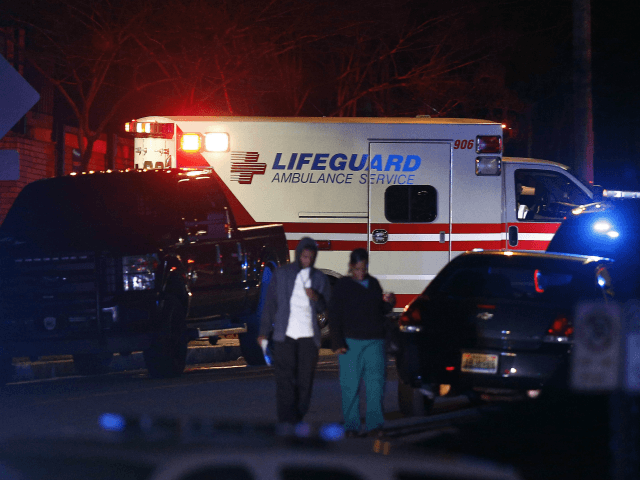 An ambulance arrives as authorities respond to a gunman that opened fire at a Birmingham,