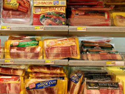 Packages of bacon are displayed on a shelf at United …