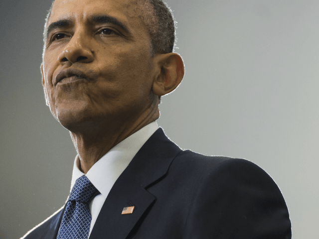 US President Barack Obama talks about his NCAA Men's College Basketball March Madness tournament bracket picks before speaking about the financial system and consumer protection at Lawson State Community College in Birmingham, Alabama, March 26, 2015. AFP PHOTO / SAUL LOEB (Photo credit should read SAUL LOEB/AFP/Getty Images)