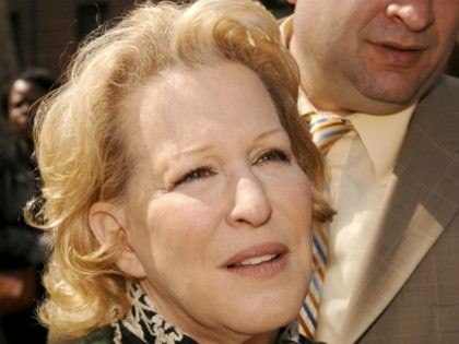 Bette Midler poses while helping to plant trees at the Martin Luther King Jr. Housing Camp