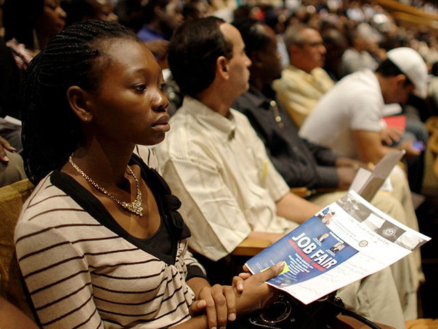 Philoria Richemond of Miami waits in an auditorium for her number to be called at a jobs fair hosted by the Congressional Black Caucus in Miami, Tuesday, Aug. 23, 2011. The fair is aimed at lowering the especially high rate of unemployment in the black community (AP Photo/Lynne Sladky).