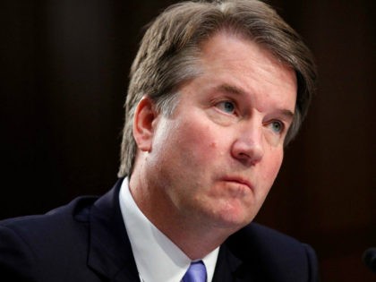 President Donald Trump's Supreme Court nominee, Brett Kavanaugh, listens to a question as