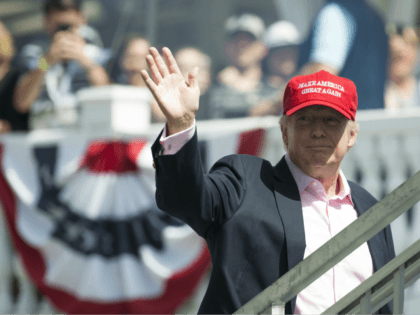 US President Donald Trump waves to wellwishers as he arrives at the 72nd US Women's Open Golf Championship at Trump National Golf Course in Bedminster, New Jersey, July 16, 2017. / AFP PHOTO / SAUL LOEB (Photo credit should read SAUL LOEB/AFP/Getty Images)