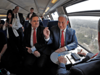 fast train israel Israeli Prime Minister Benjamin Netanyahu (R) sits next to Israel's Transportation and Intelligence Minister Yisrael Katz during a test-run of the new high-speed train between Jerusalem and Tel Aviv, near Lod and Ben Gurion international Airport, on September 20, 2018. (Photo by Thomas COEX / AFP) (Photo credit should read …