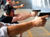 gun-training-course-armed-teachers-getty-photo John MacFarlane, a Colorado high school physics teacher from Colorado school District 20, fires his gun during a firearms course for school teachers and administrators offered by FASTER Colorado at Flatrock Training Center in Commerce City, Colorado on June 26, 2018. - FASTER Colorado has been sponsoring firearms training to …