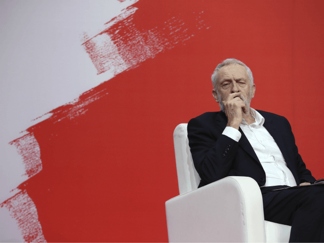 Jeremy Corbyn, leader of Britain's Labour Party, listens to speakers during the Party of European Socialists Council in Lisbon, Saturday, Dec. 2 2017. (AP Photo/Armando Franca)